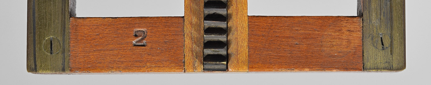 1241.american.optical-front.focus.cone.var.2-4x5-stamp.top.end.of.platform.assembly.no.2-1500.jpg